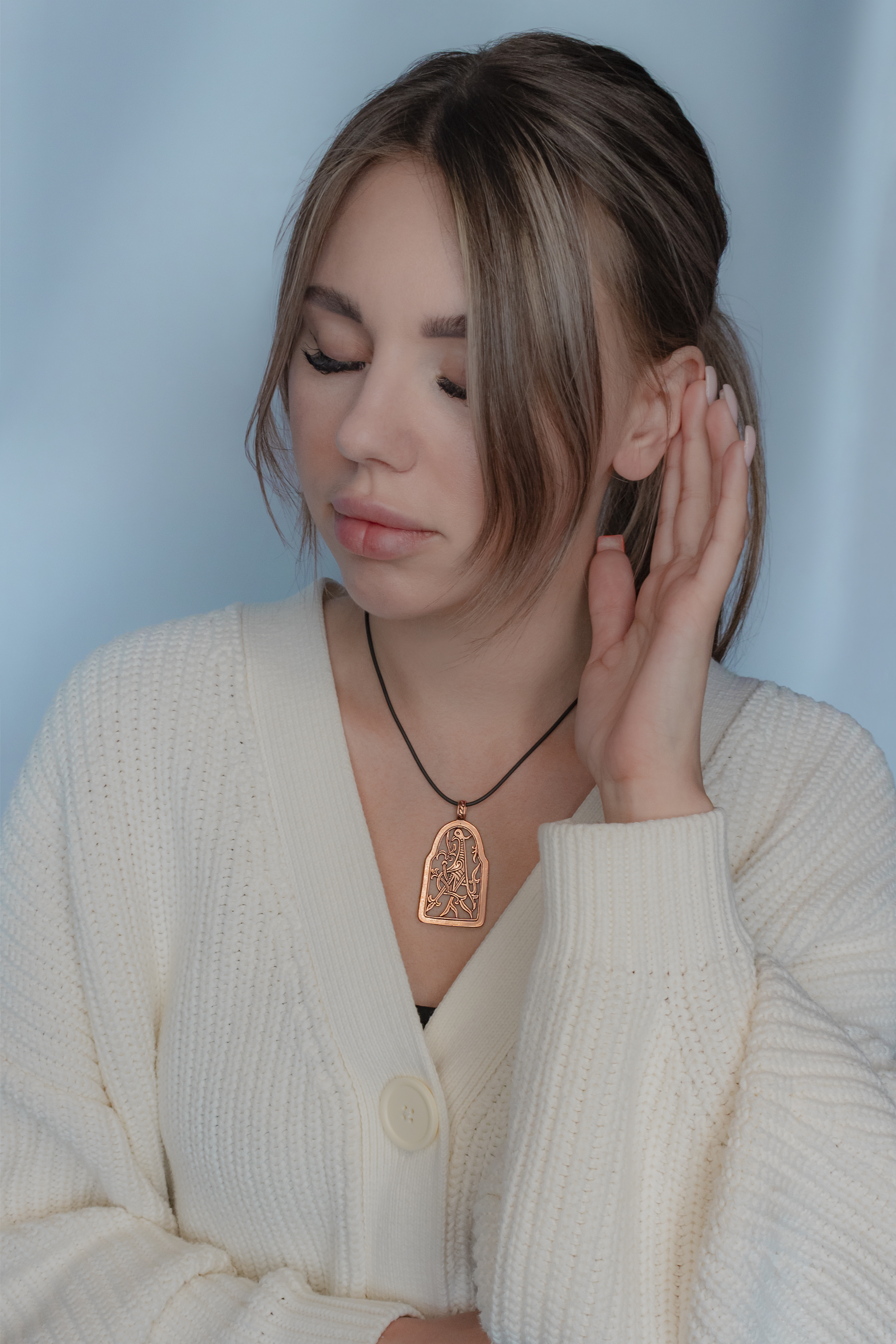 Slotted pendant "Bird with intertwined tail"